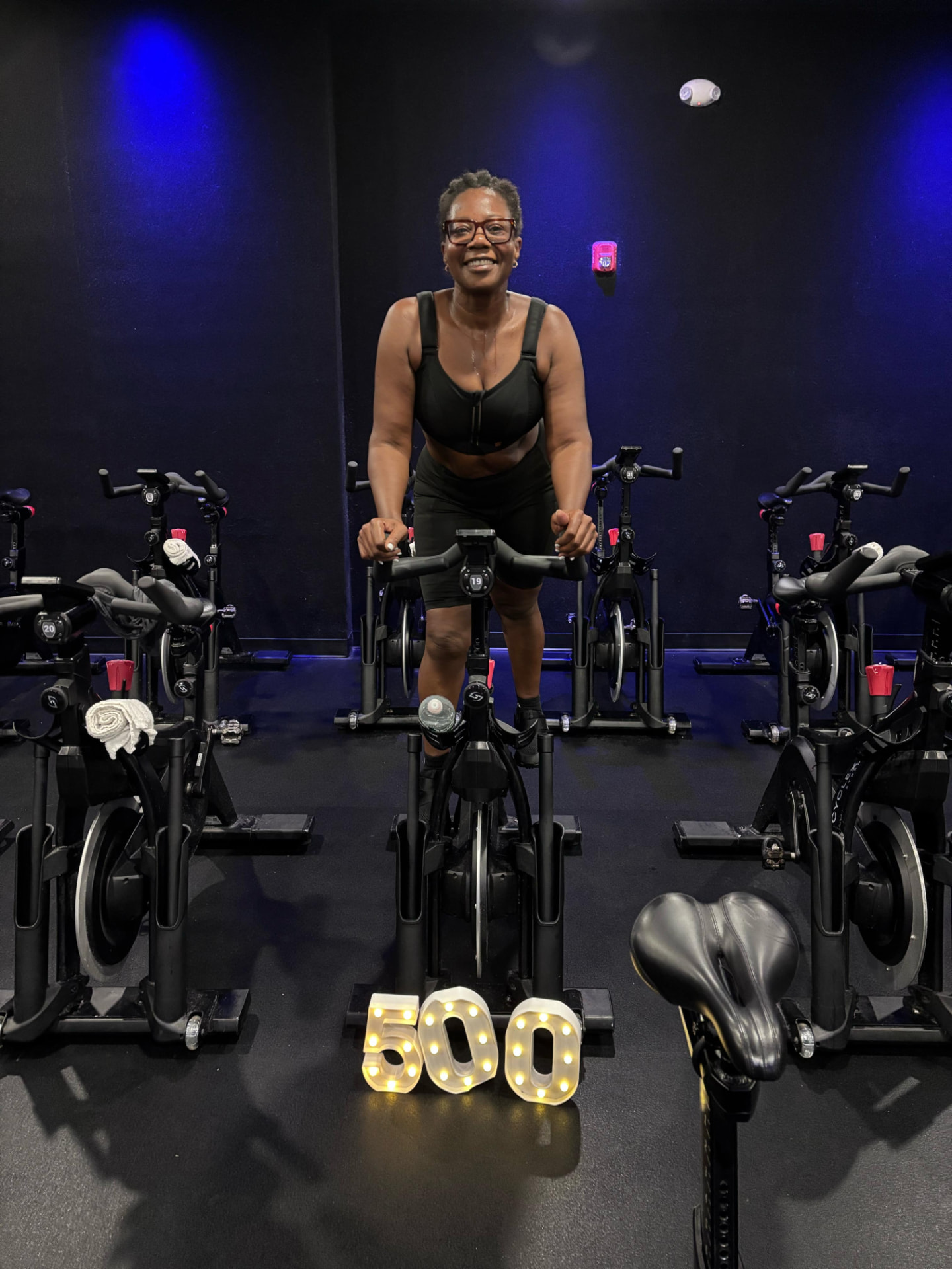 A member celebrating her 500th class on the bike